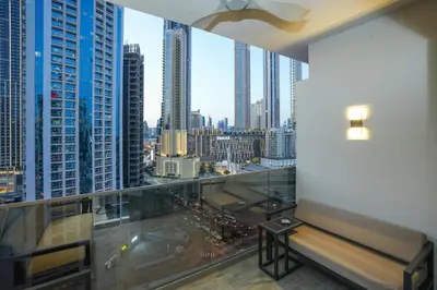 a balcony with a view of a city from a building at Lux Studio in Downtown, 5 mins to Burj Khalifa & Dubai Mall - MAG318 in Dubai
