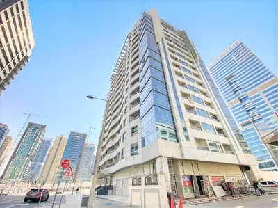 a tall building on a city street with tall buildings at Royal Casa- Marina Diamond 2 in Dubai