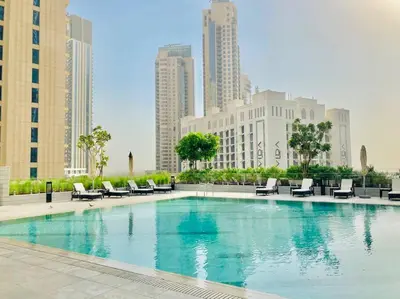 a large swimming pool in a city with buildings at Elegant & Chic 2bedroom balcony Creek Waterfront in Dubai