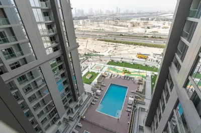 a view from the top of a building with tall buildings at Cozy 1bdr 10' from Burj Khalifa in Dubai