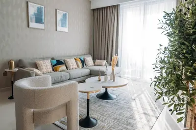 a living room with a couch and a table at Modern & Chic 2bedroom with Balcony Dubai Creek in Dubai