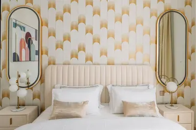 a bedroom with two beds and two mirrors at Modern & Chic 2bedroom with Balcony Dubai Creek in Dubai