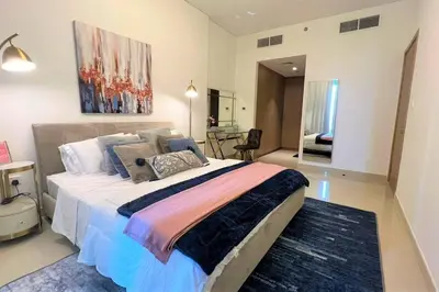 a bedroom with a large bed in a room at Modern & Chic Waterfront 2bed balcony Dubai Creek in Dubai