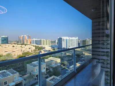 a view of the city from the balcony of a building at Upgraded 1 Bhk Silicon Oasis Short or long rental in Dubai