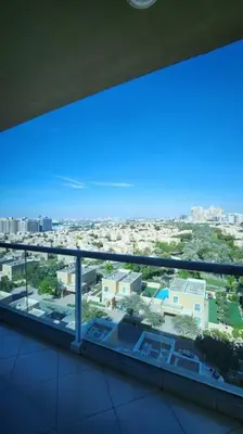 a view of a city from the balcony of a building at Upgraded 1 Bhk Silicon Oasis Short or long rental in Dubai