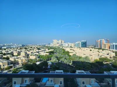 a view of the city from the balcony of a apartment at Upgraded 1 Bhk Silicon Oasis Short or long rental in Dubai