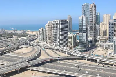 an overhead view of a highway in a city with tall buildings at Scenic lake view 2BR near metro in Cluster A, JLT - Allsopp&Allsopp in Dubai