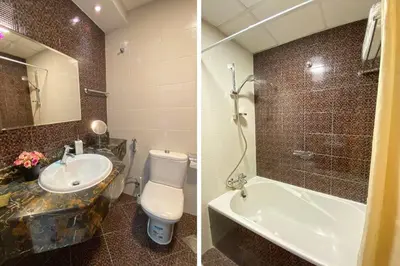 a bathroom with a toilet and a sink and a tub at Elegant Studio in Dubai Marina Near Beach and Metro Z1013 in Dubai