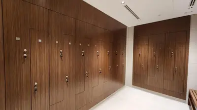 a row of wooden lockers in a locker room at STAY BY LATINEM Luxury 1BR Holiday Home CVR A2609 near Burj Khalifa in Dubai