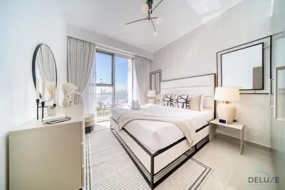 a bedroom with a bed and a large window at Captivating 1BR at 17 Icon Bay Dubai Creek Harbour by Deluxe Holiday Homes in Dubai
