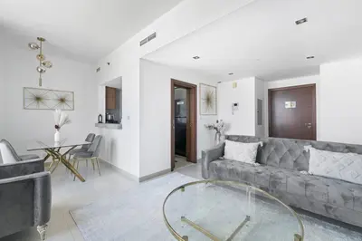 a living room with a couch and a glass table at StoneTree - Park Island Blakely 1 BR - Prime location in Dubai