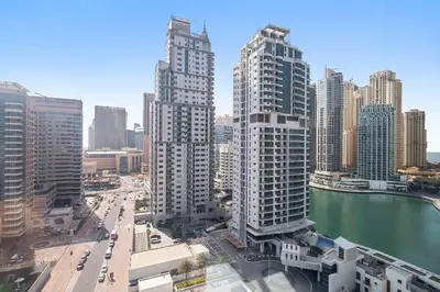 a view of a city with tall buildings and a river at StoneTree - Time Place Tower 1 BR - Amazing View in Dubai