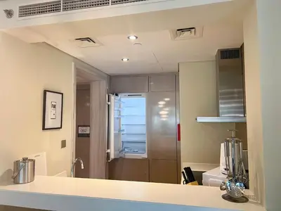a bathroom with a sink and a mirror at Luton Vacation Homes - Damac Tower By Paramount - Business Bay, Dubai - 80AB4 in Dubai