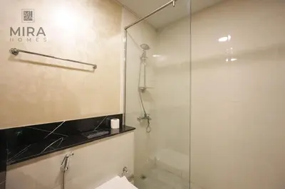 a bathroom with a glass shower and a sink at Mira Holiday Homes - Fully furnished Studio in Business Bay in Dubai