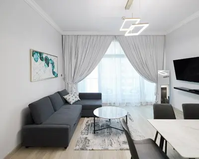 a living room with a couch and a table at 1 bedroom in Torch Tower Dubai Marina in Dubai
