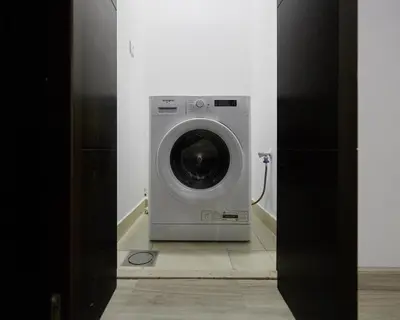 a washer and dryer in a room at 1 bedroom in Torch Tower Dubai Marina in Dubai