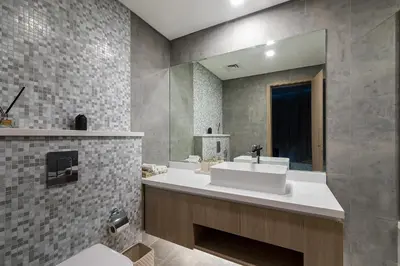 a bathroom with a white sink and a mirror at Luxury Residence Stella Maris in Dubai