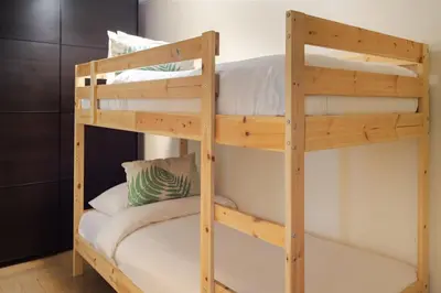 a couple of bunk beds in a room at Al Bateen Residences, Jumeirah Beach Residence - Mint Stay in Dubai