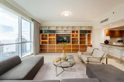 a living room with a couch and a table at Al Bateen Residences, Jumeirah Beach Residence - Mint Stay in Dubai