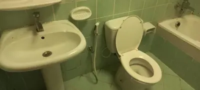 a bathroom with a toilet and a sink at Budget Place in Dubai
