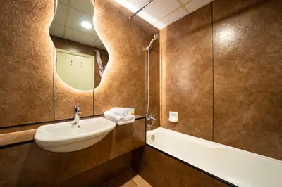 a bathroom with a sink and a bath tub at Scala Tower Central Chic with a twist studio in Dubai