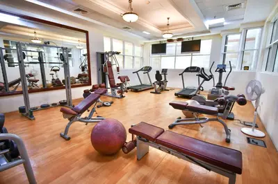a gym with a bunch of exercise equipment in a room at Scala Tower Central Chic with a twist studio in Dubai