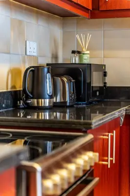 a kitchen with a counter top with a microwave at Spacious 2BR - Dubai Eye & Sea View - JBR in Dubai