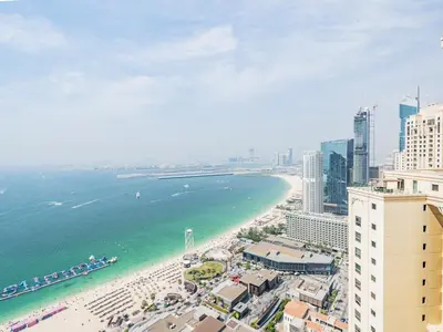 an aerial view of a beach and the ocean at Spacious 2BR - Dubai Eye & Sea View - JBR in Dubai