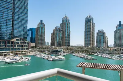 a view of a harbor with boats in a city at Vacay Lettings- Stylish waterfront getaway home in Dubai