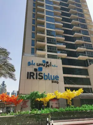 a building with an iris blueiger sign on it at Vacay Lettings- Stylish waterfront getaway home in Dubai