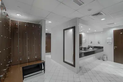 a locker room with a sink and a mirror at Icon Delux Hotel Apartments Al Barsha - Formerly Abidos in Dubai