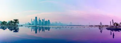 a view of a city from a body of water at 2 Bedroom App with private beach and infinity pool in Dubai