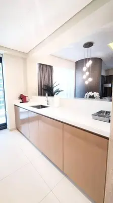 a kitchen with a white counter and a sink at Luxury apartment Paramount Hotel A21 in Dubai