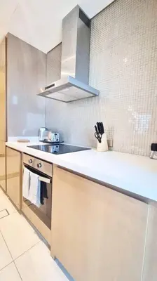 a kitchen with a sink and a counter top at Luxury apartment Paramount Hotel A21 in Dubai