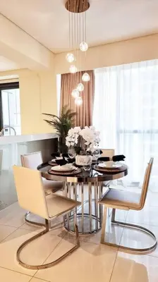 a dining room with a table and some chairs at Luxury apartment Paramount Hotel A21 in Dubai