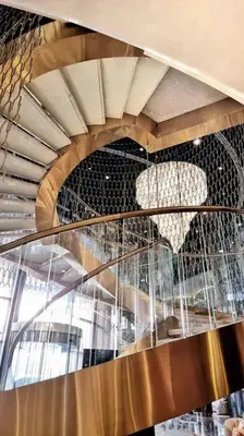 a spiral staircase with a chair on top of it at Luxury apartment Paramount Hotel A21 in Dubai