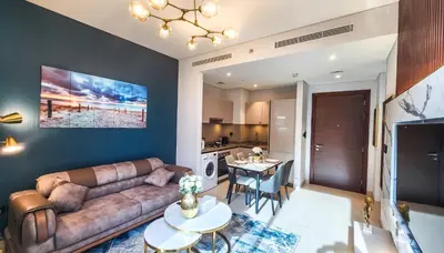 a living room with a couch and a table at STAY La Casa Da Vinci 1BR Holiday Home CVR B3002 near Burj Khalifa in Dubai