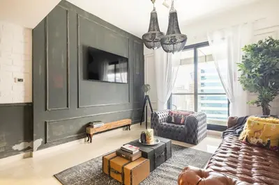 a living room with a large green wall at Beautiful home, Magnificent view in Dubai