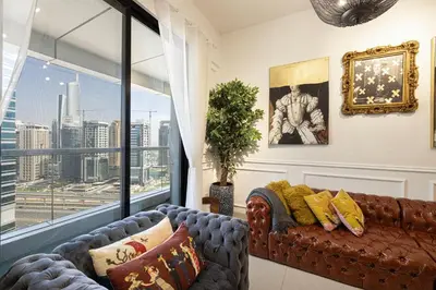 a living room with a couch and a large window at Beautiful home, Magnificent view in Dubai
