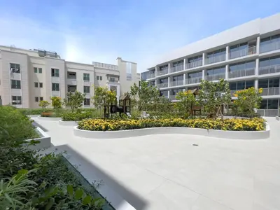 an empty courtyard in front of a building at Brand New Vibrant Studio in JVC in Dubai