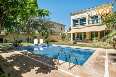 a swimming pool in front of a house at Keysplease Amazing 2 B/R Villa With private Pool, JVT in Dubai