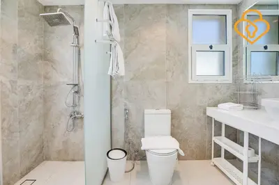 a bathroom with a toilet and a sink and a shower at Keysplease Amazing 2 B/R Villa With private Pool, JVT in Dubai