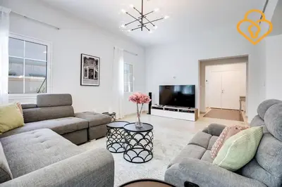 a living room with two couches and a tv at Keysplease Amazing 2 B/R Villa With private Pool, JVT in Dubai