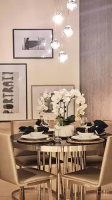 a dining room with a table with flowers and chairs at Amazing Paramount Hotel apartment D48 in Dubai