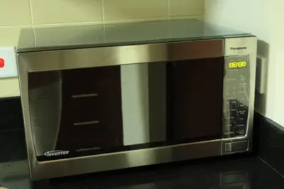 a microwave oven sitting on top of a counter at 2BR Jumeirah Beach front Residence in Dubai