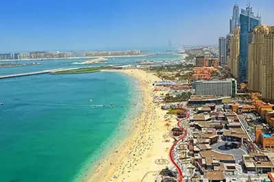 a view of a beach with hotels and the ocean at 2BR Jumeirah Beach front Residence in Dubai