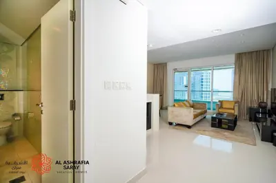 a living room with a view of a living room at Alashrafia Saray - Superb 1 BR in Canal Views in Dubai