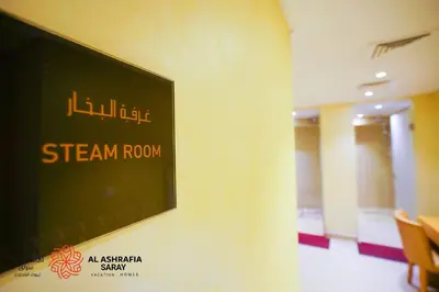 a sign on a wall in a room at Alashrafia Saray - Fabulous 1BR in Canal Views in Dubai