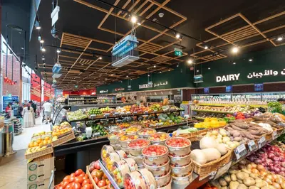 a grocery store filled with lots of fruits and vegetables at Prestige Living 1BR with Full Burj Khalifa View by Auberge in Dubai