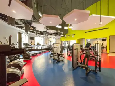 a gym with rows of treadmills and machines at Dominant View of Dubai Marina in Dubai